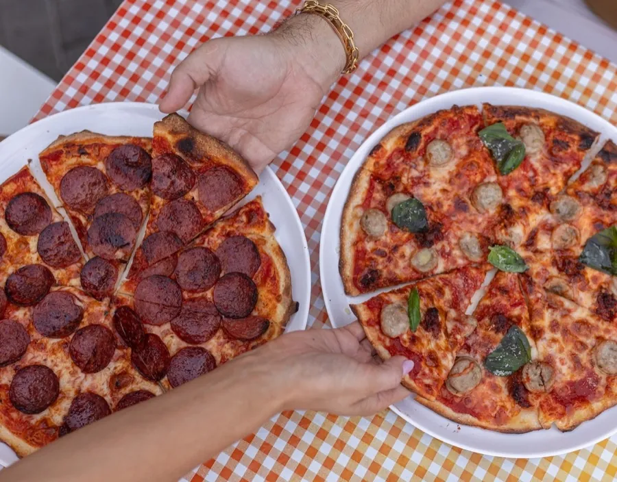 Pizzas being shared at Bar Lago